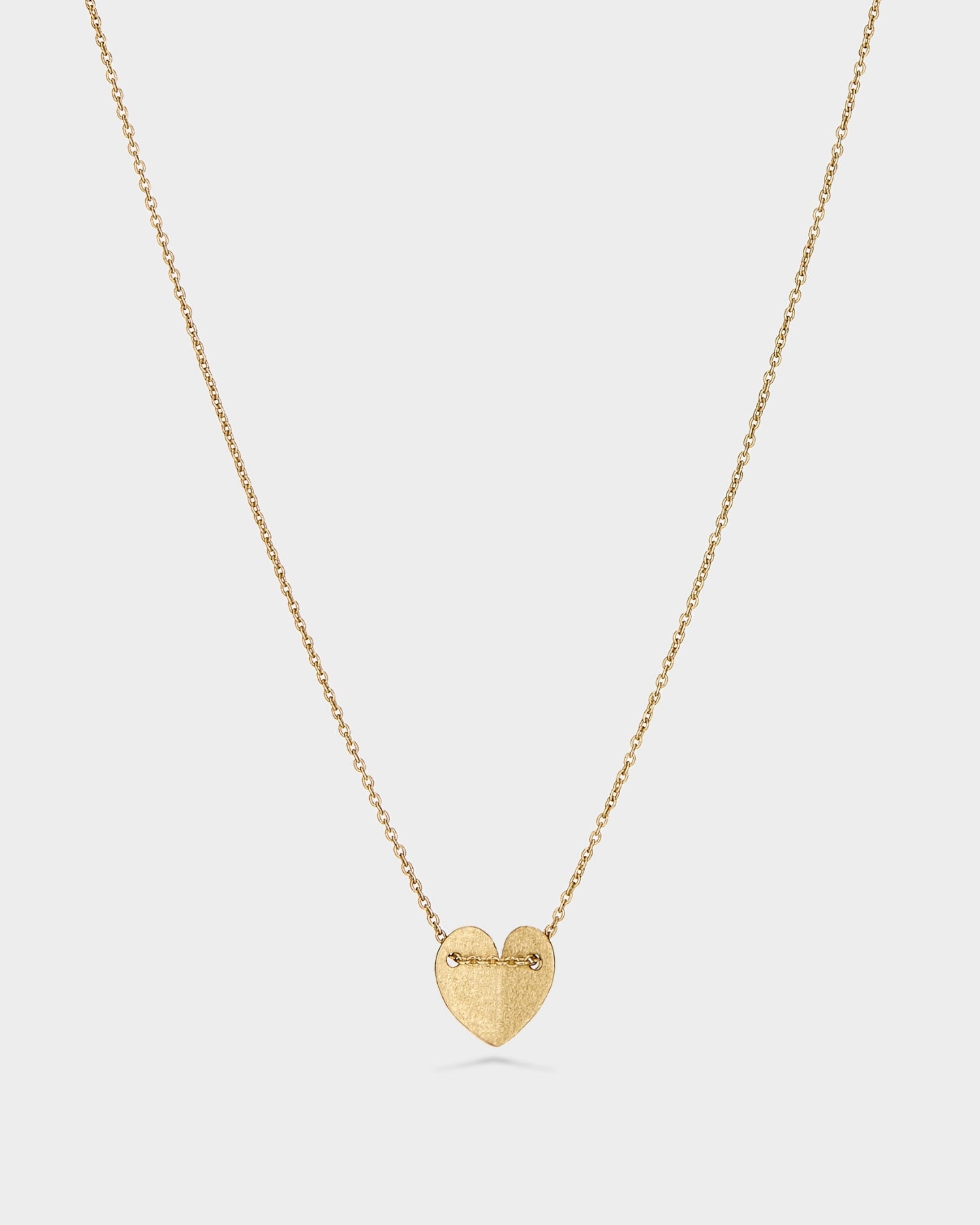 Yellow gold small solid heart necklace