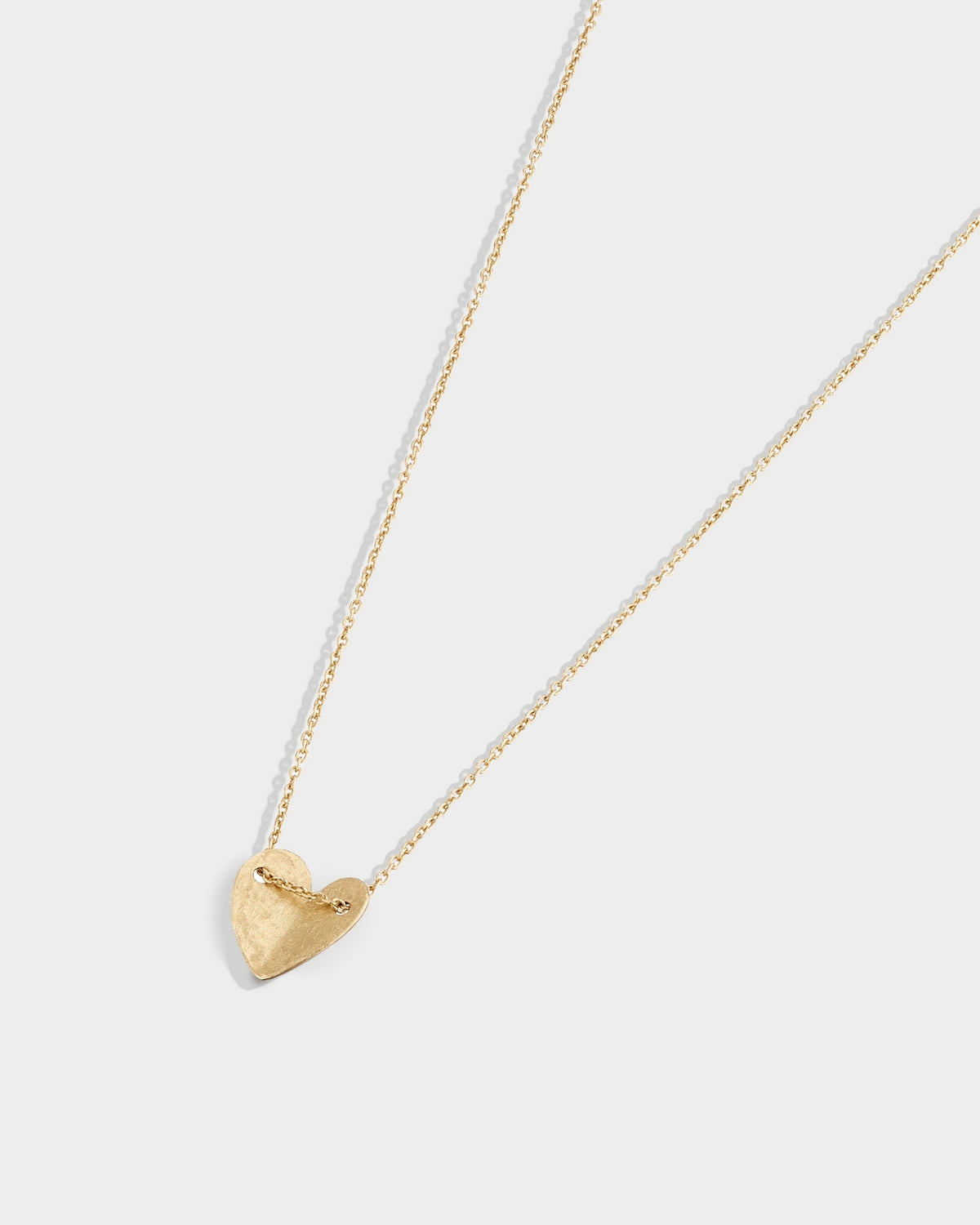 Yellow gold small solid heart necklace