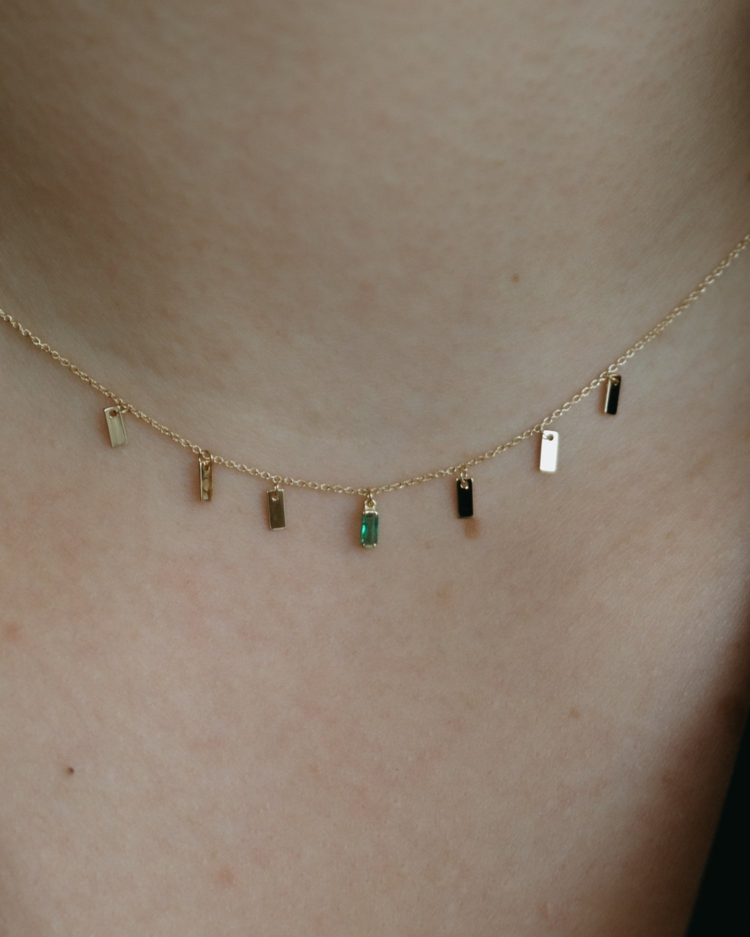 Baguette 14k gold string necklace with emerald gemstone