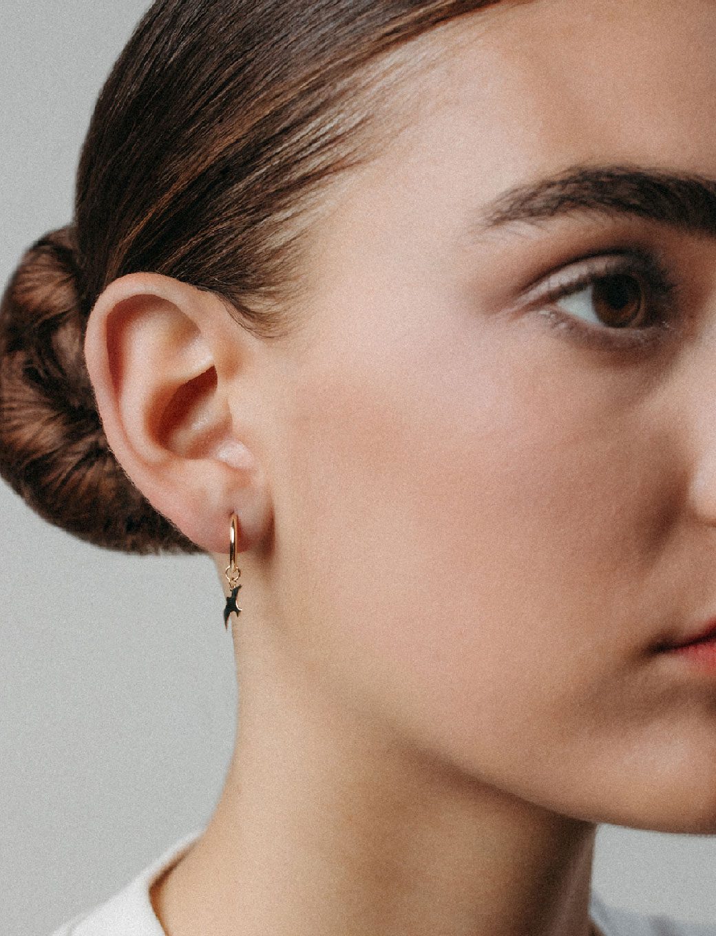 Small yellow gold bird hoop earrings