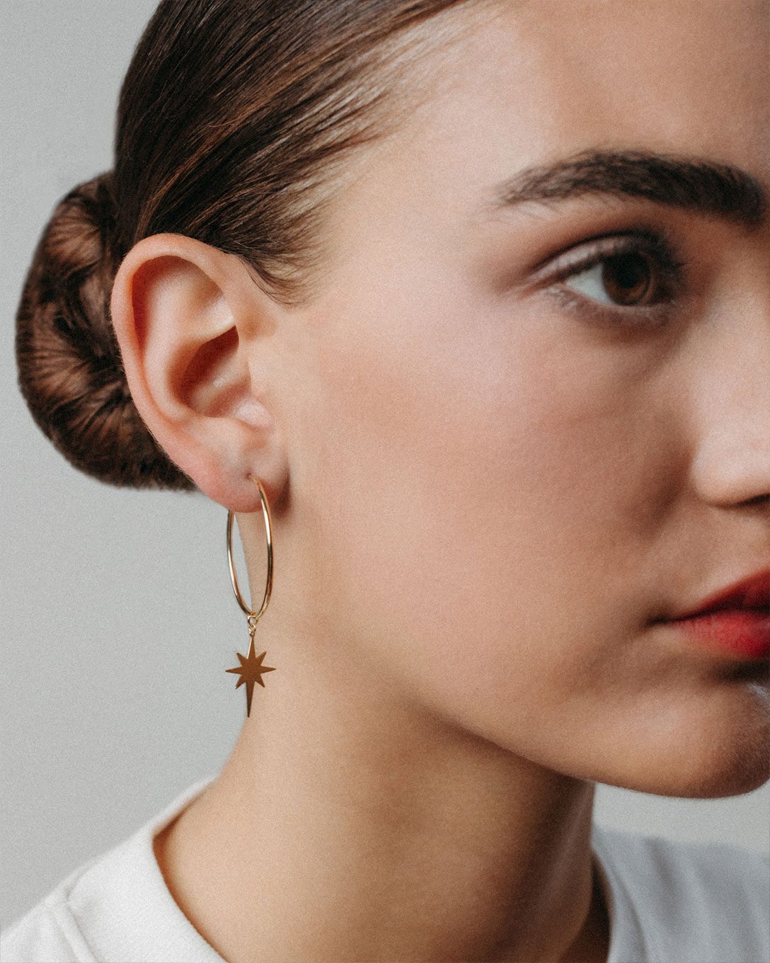 Large yellow gold star hoop earrings