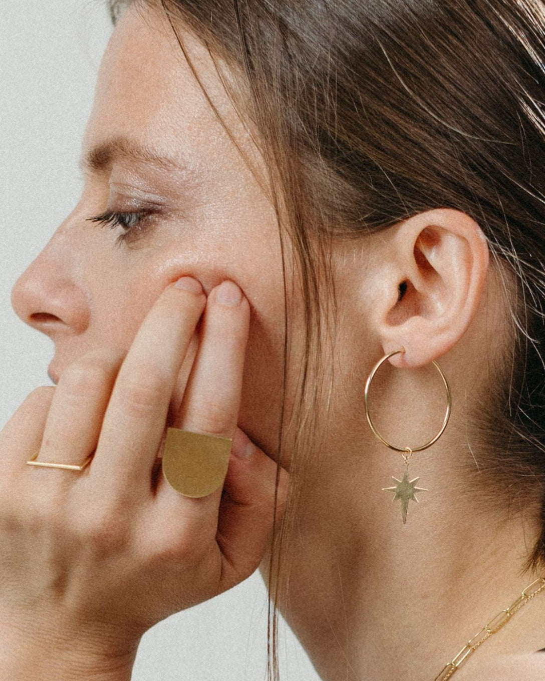 Large yellow gold star hoop earrings