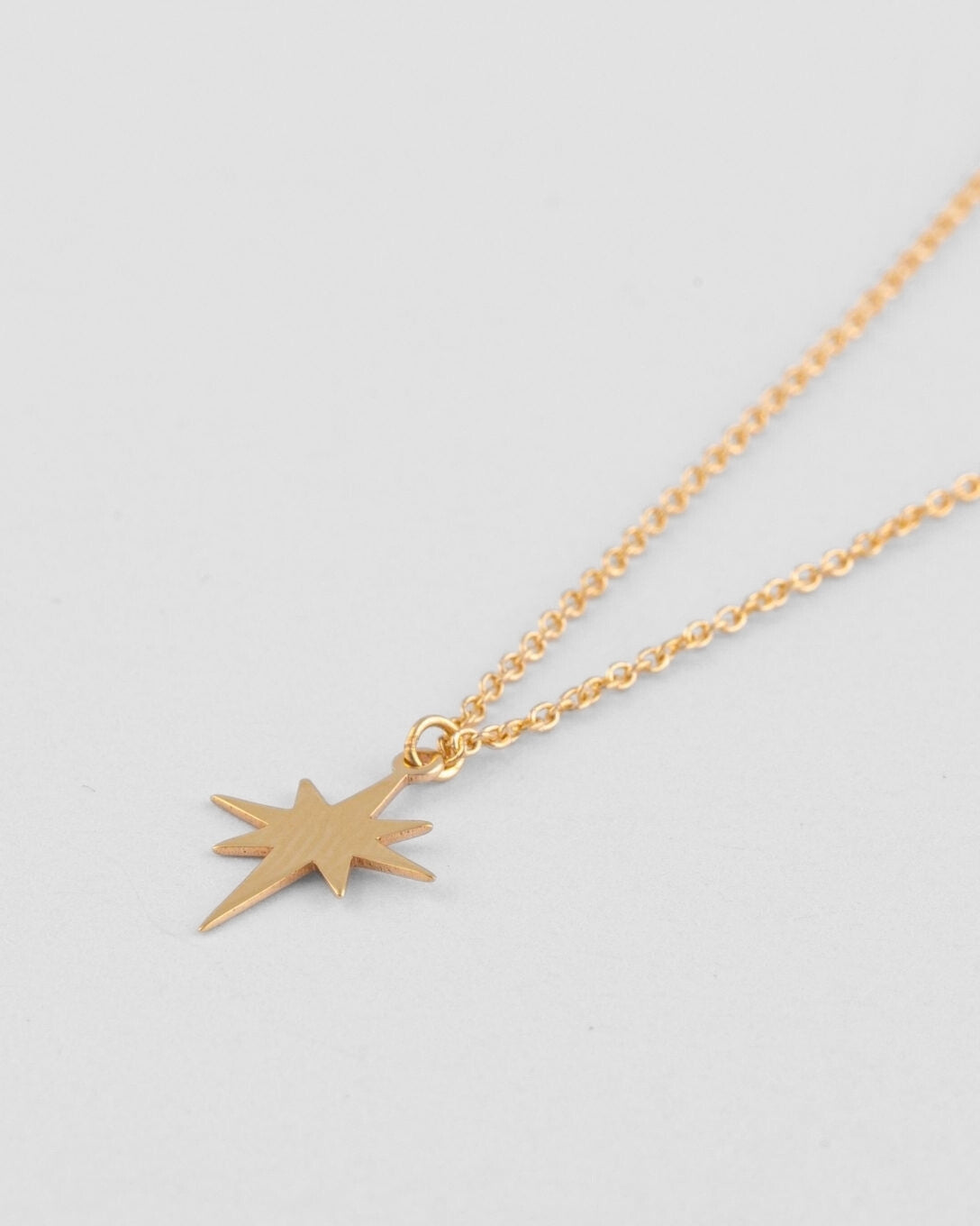 Yellow gold star necklace