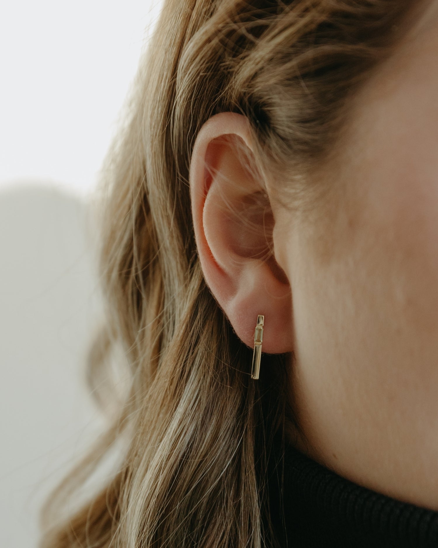 Baguette 14k gold linear earrings with peridot gemstones