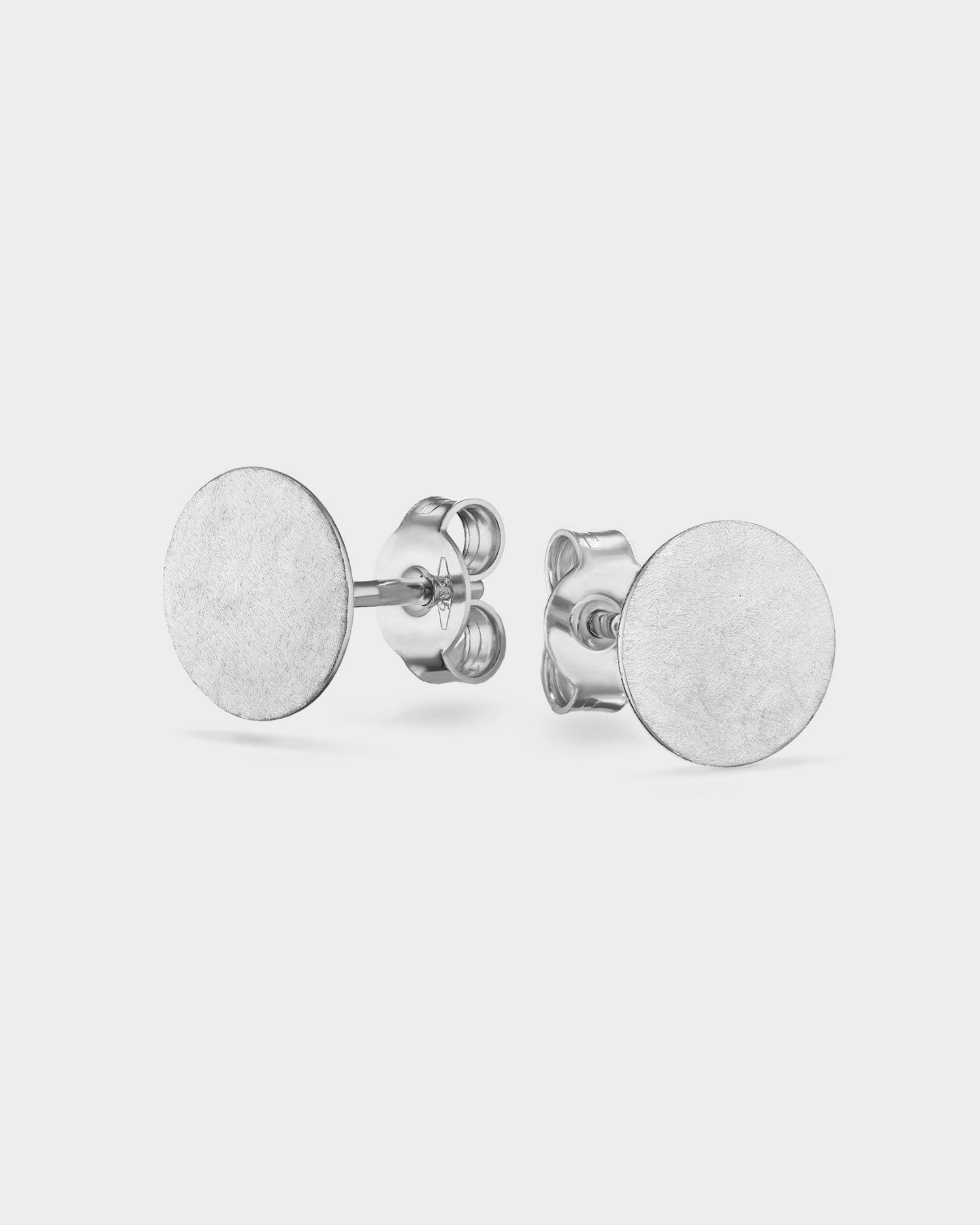 Brushed white gold mini circle stud earrings