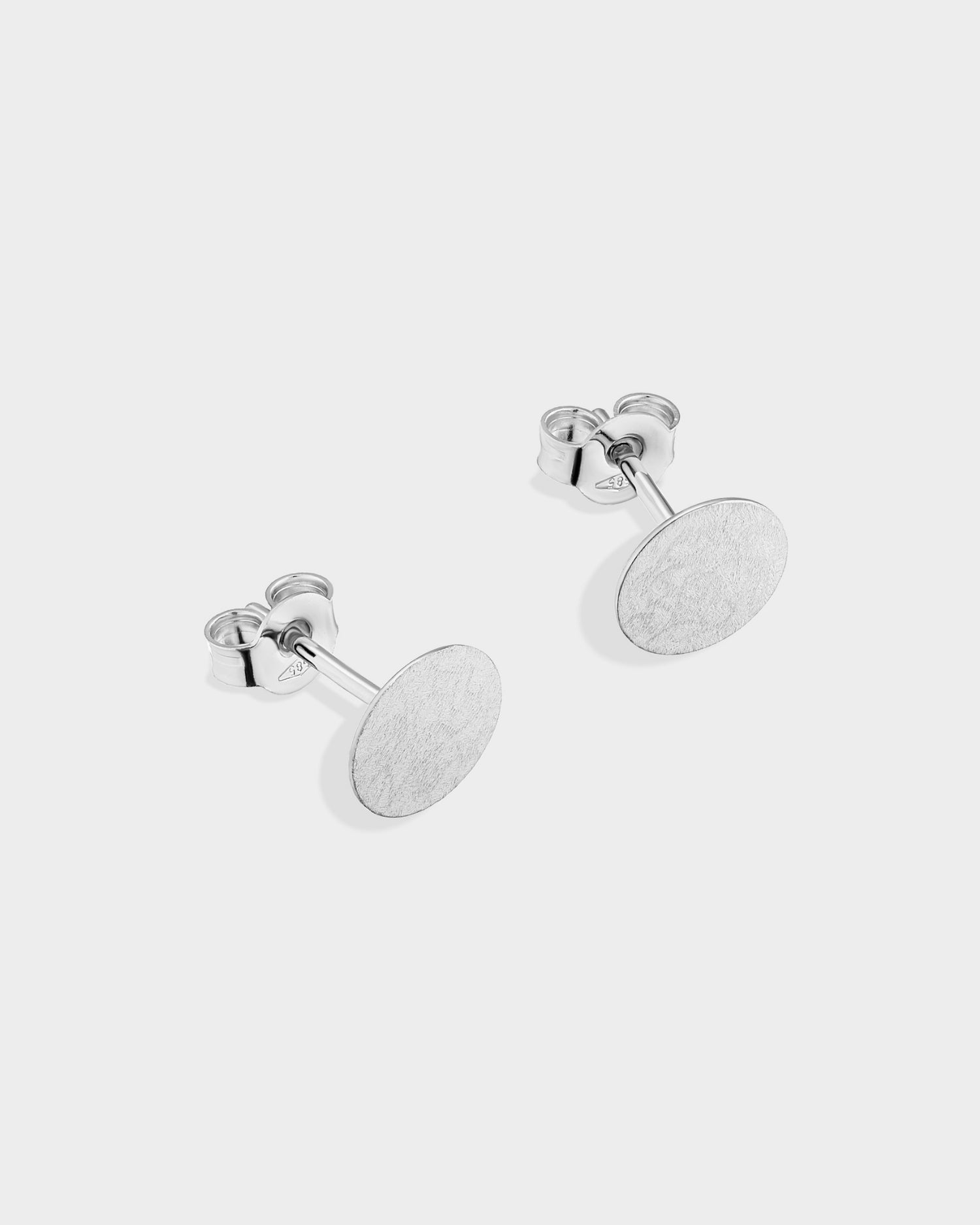 Brushed white gold mini circle stud earrings