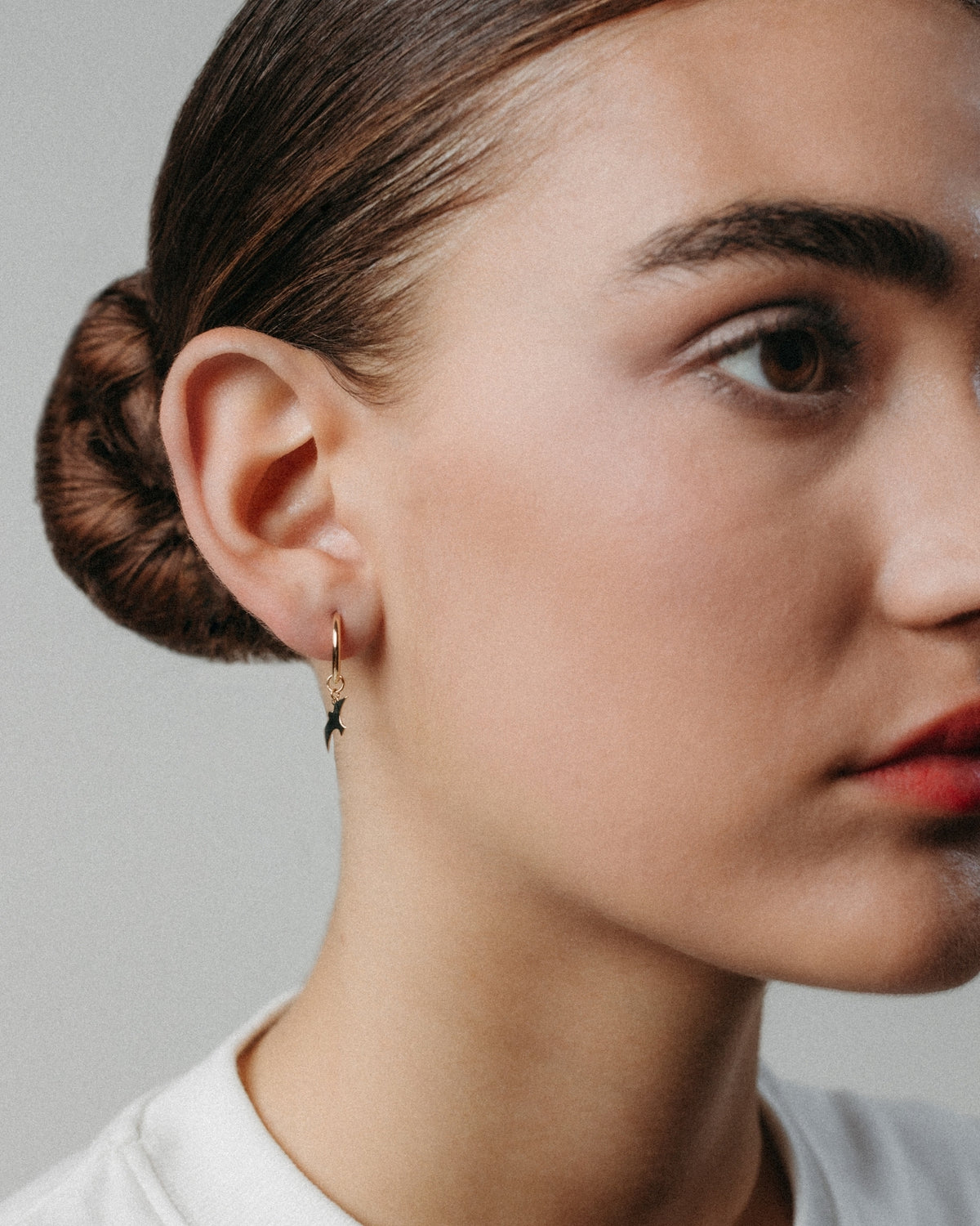 Small yellow gold bird hoop earrings