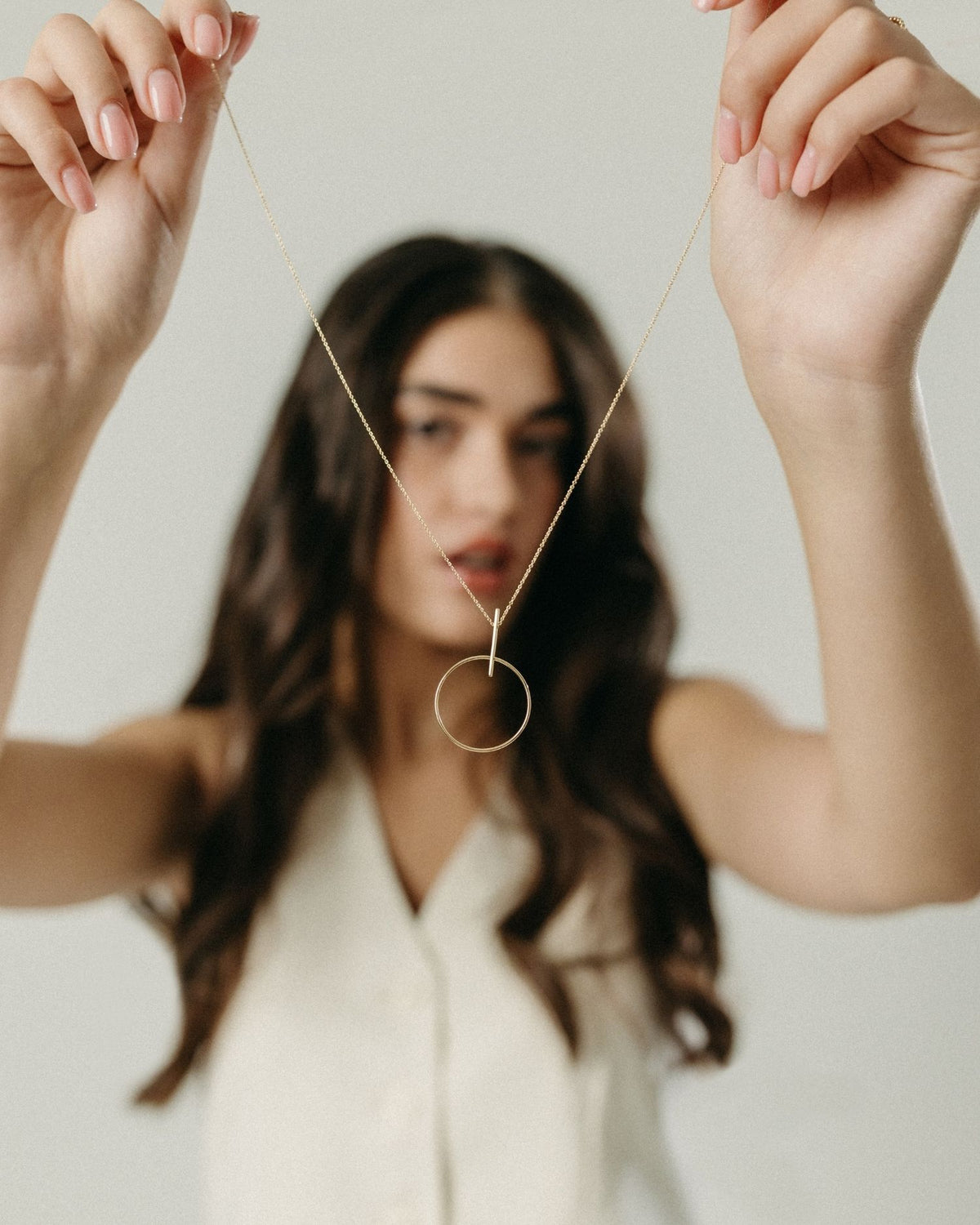 Yellow gold circle and line necklace