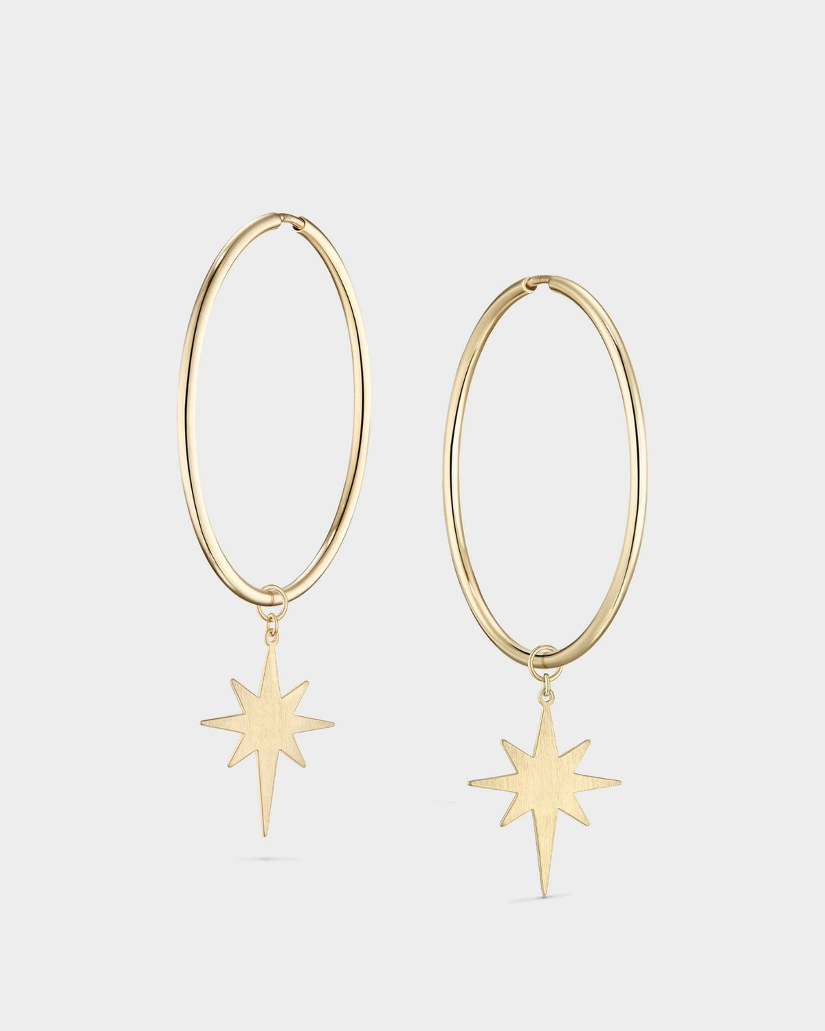 Large yellow gold star hoop earrings