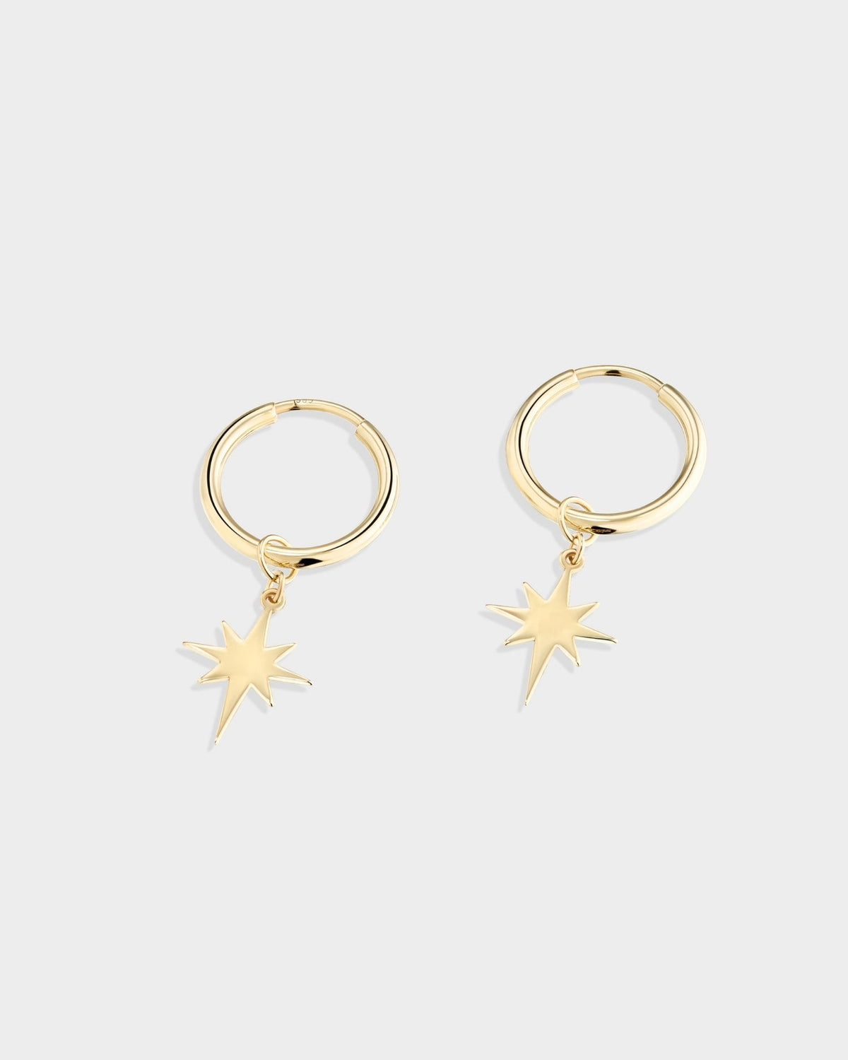Small yellow gold star hoop earrings