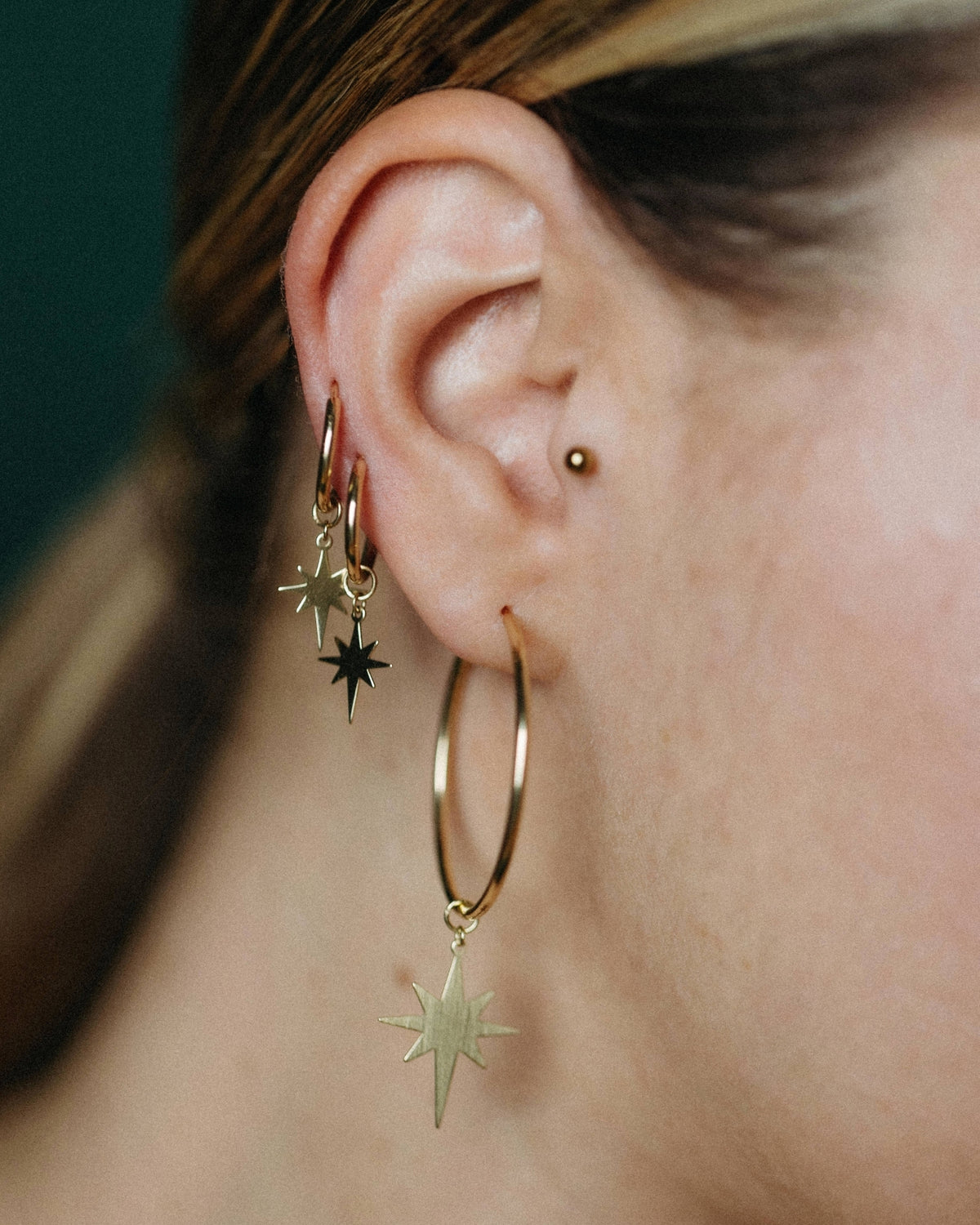 Small yellow gold star hoop earrings