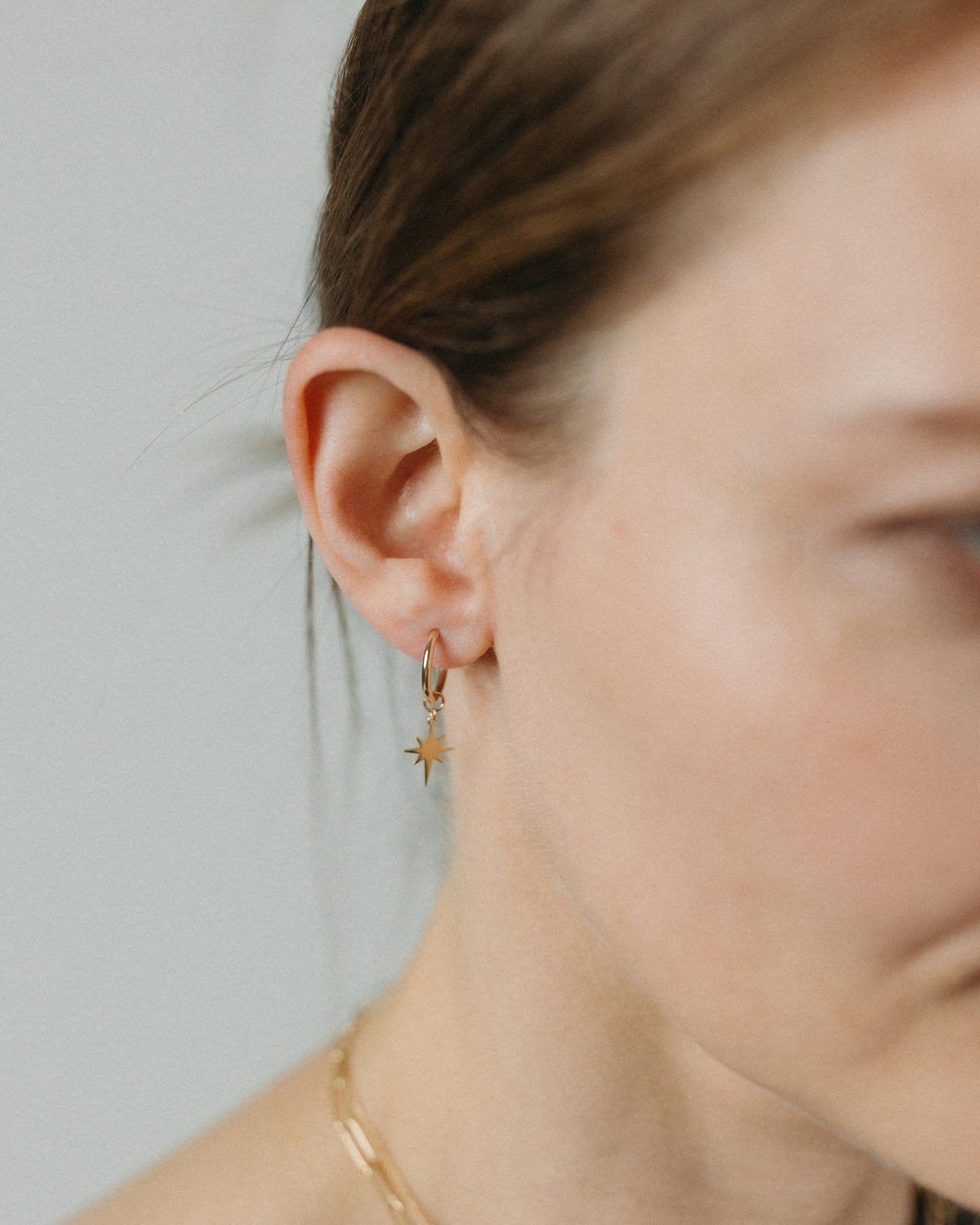 Small yellow gold star hoop earrings