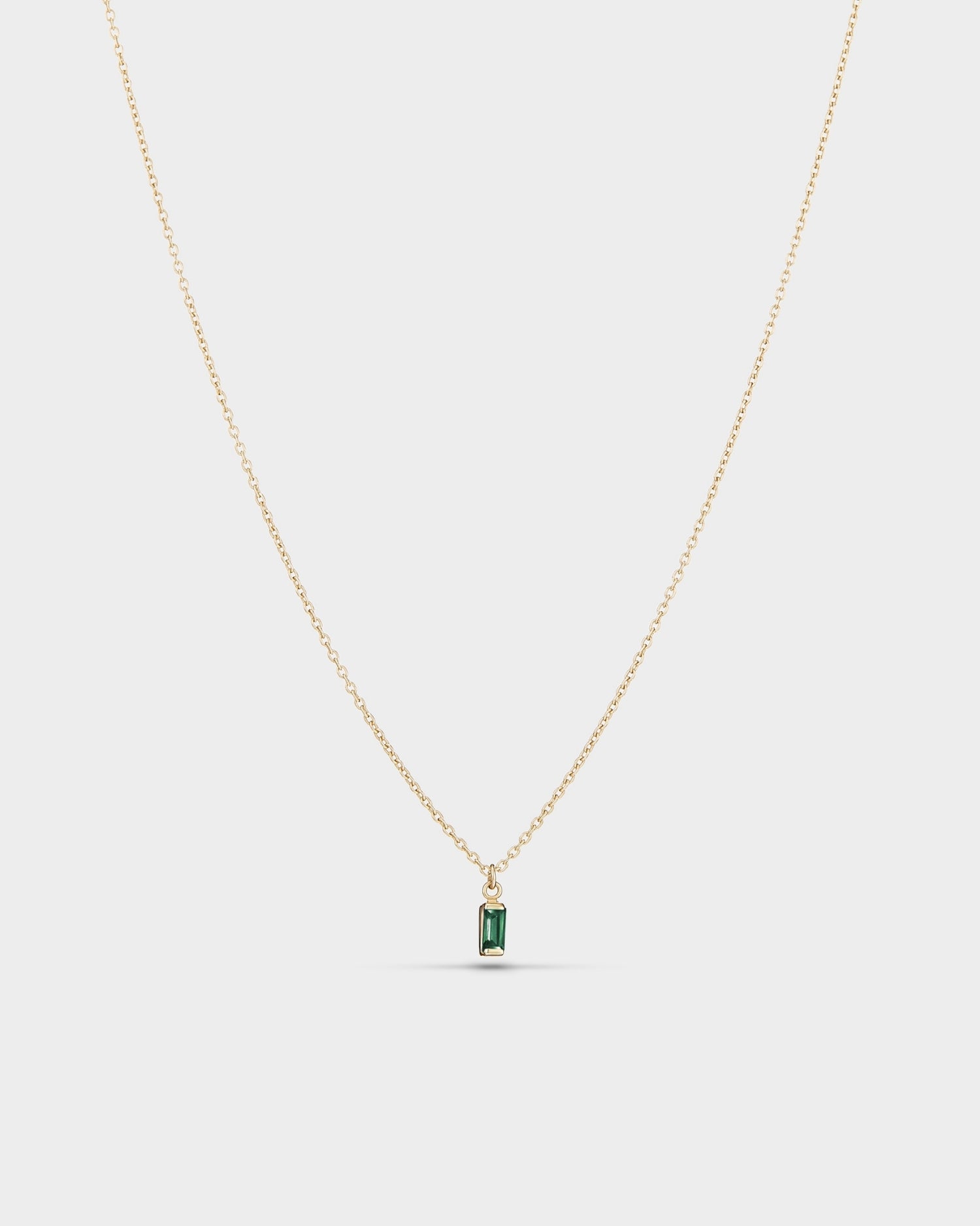 Baguette 14k gold necklace with emerald gemstone
