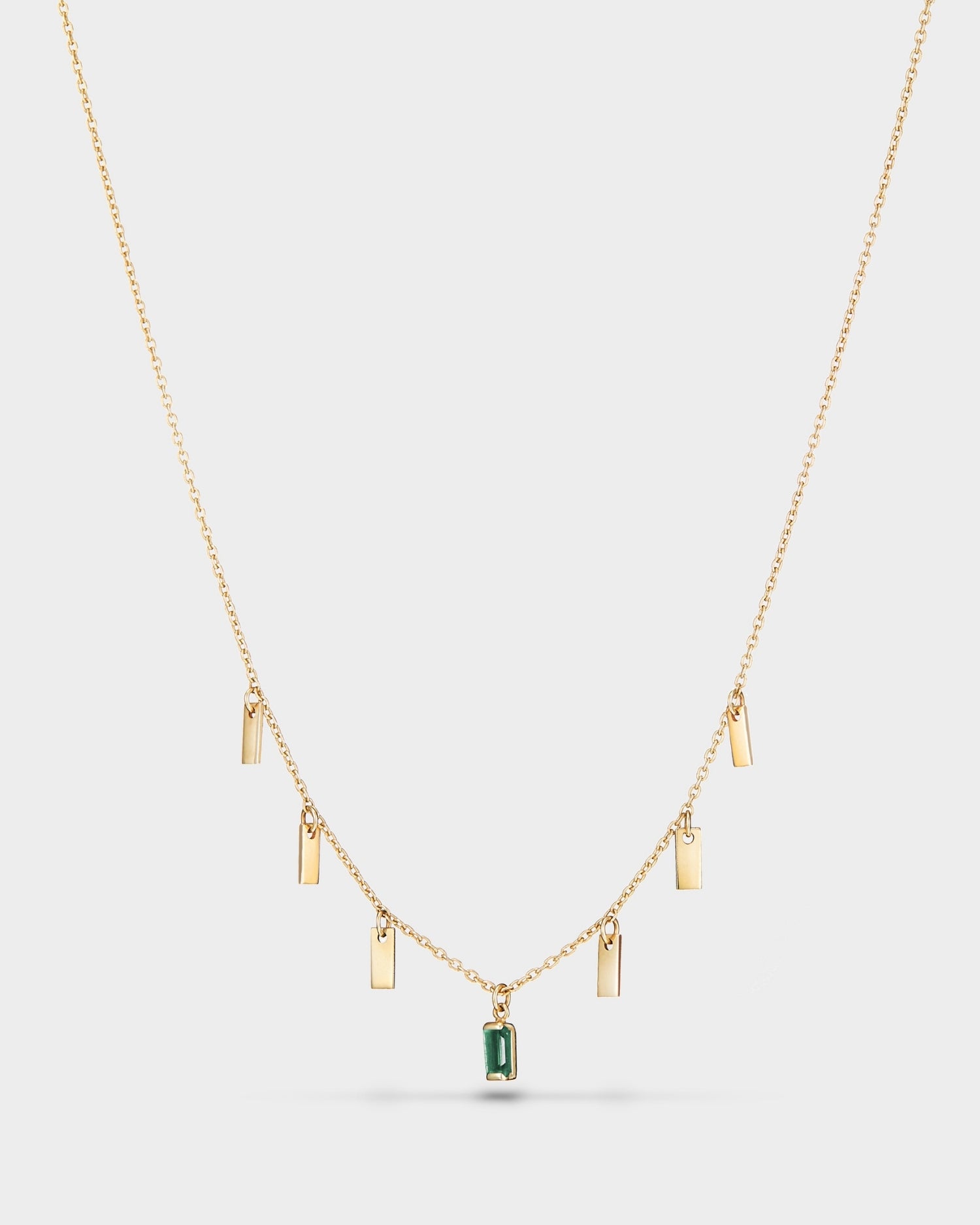 Baguette 14k gold string necklace with emerald gemstone