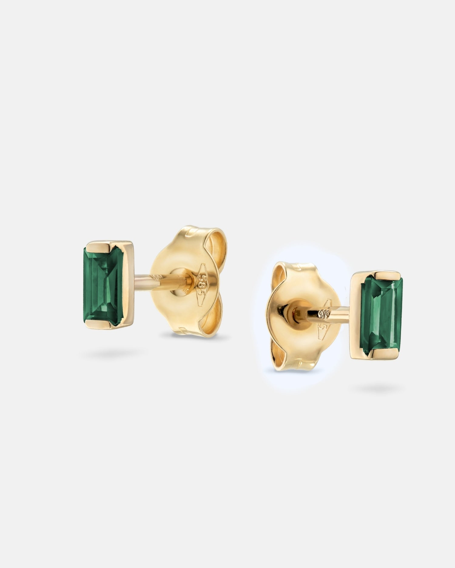 Baguette 14k gold stud earrings with emerald gemstones