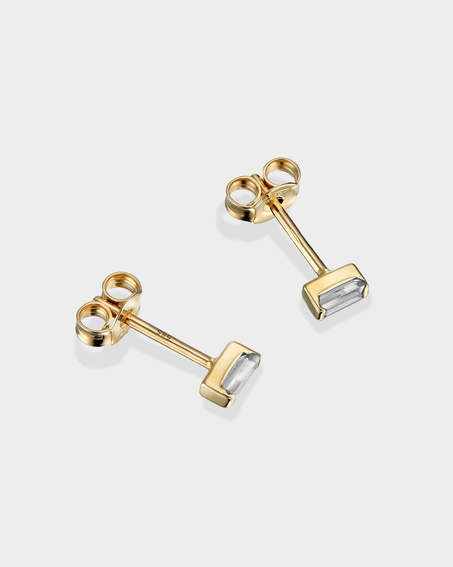 Baguette 14k gold stud earrings with natural diamonds