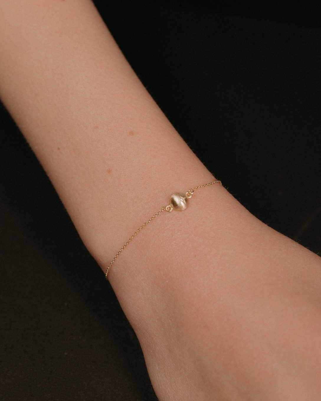 Yellow gold diamond globe bracelet