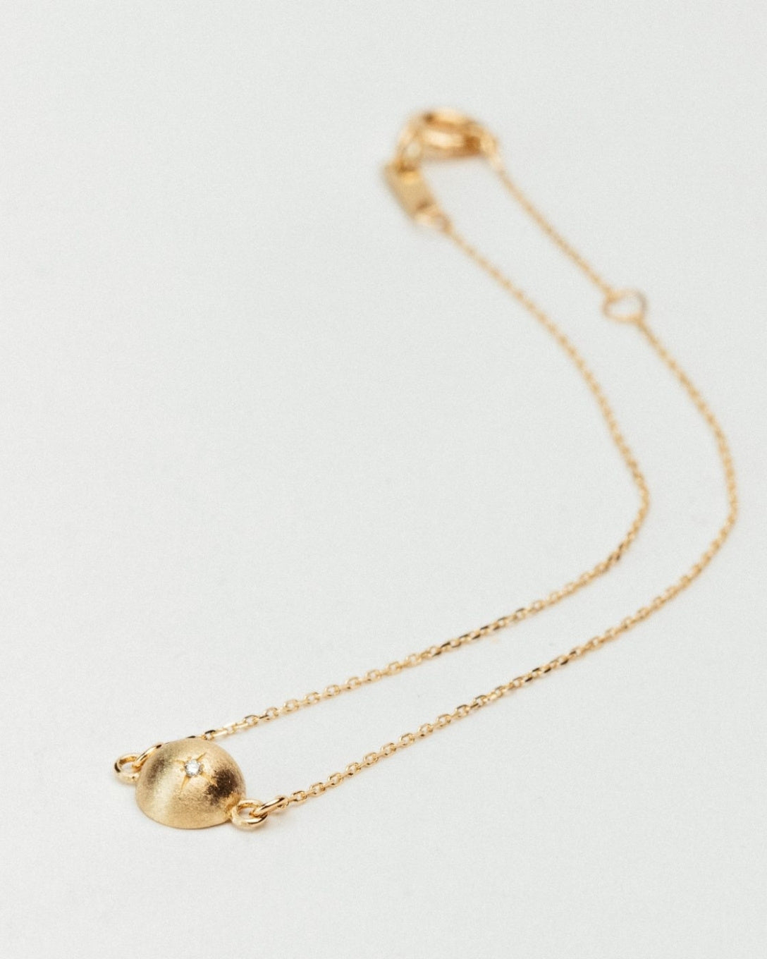 Yellow gold diamond globe bracelet