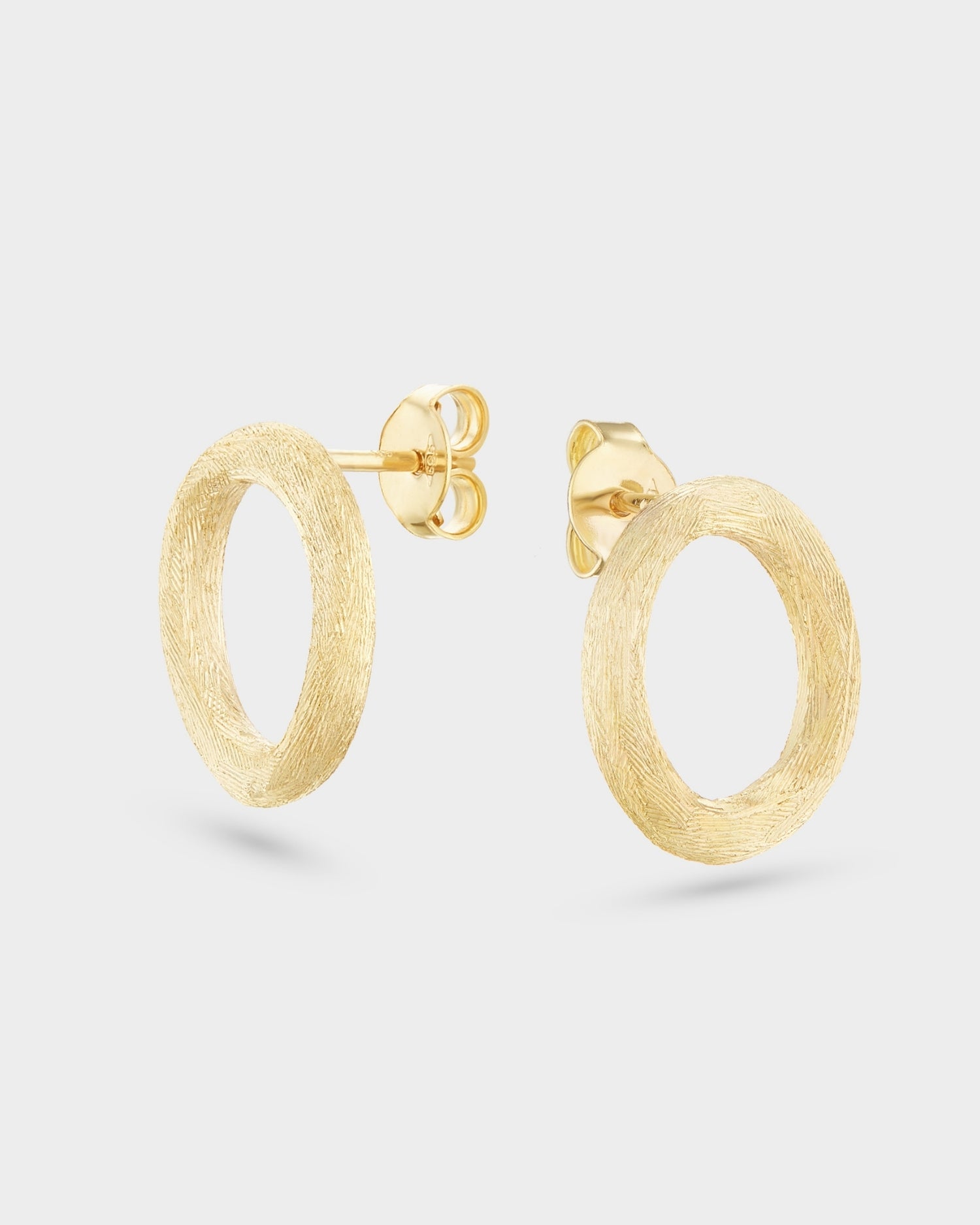 Brushed circle yellow gold stud earrings