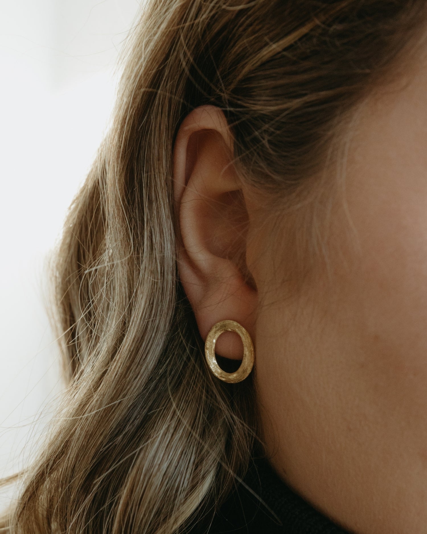 Brushed circle yellow gold stud earrings