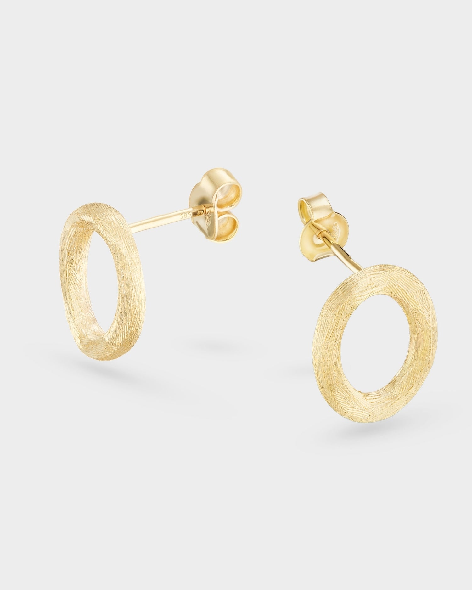 Brushed circle yellow gold stud earrings
