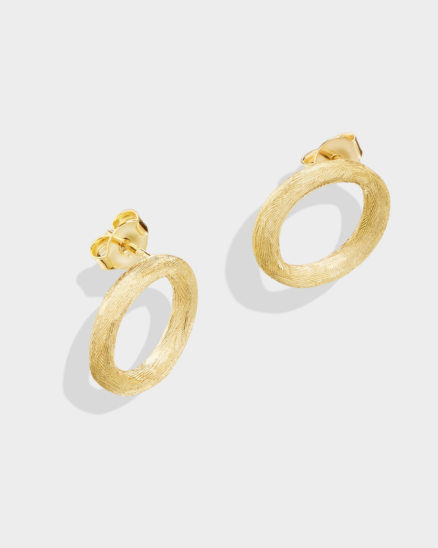Brushed circle yellow gold stud earrings