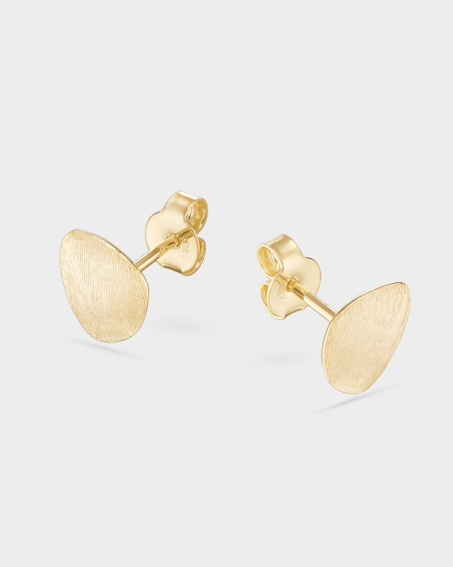 Brushed yellow gold mini stud earrings
