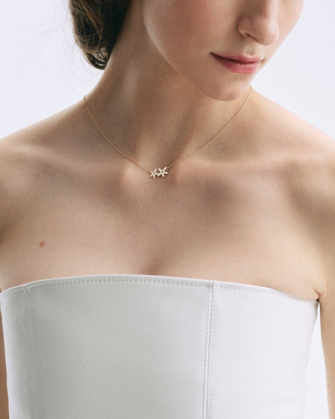 Yellow gold bat necklace