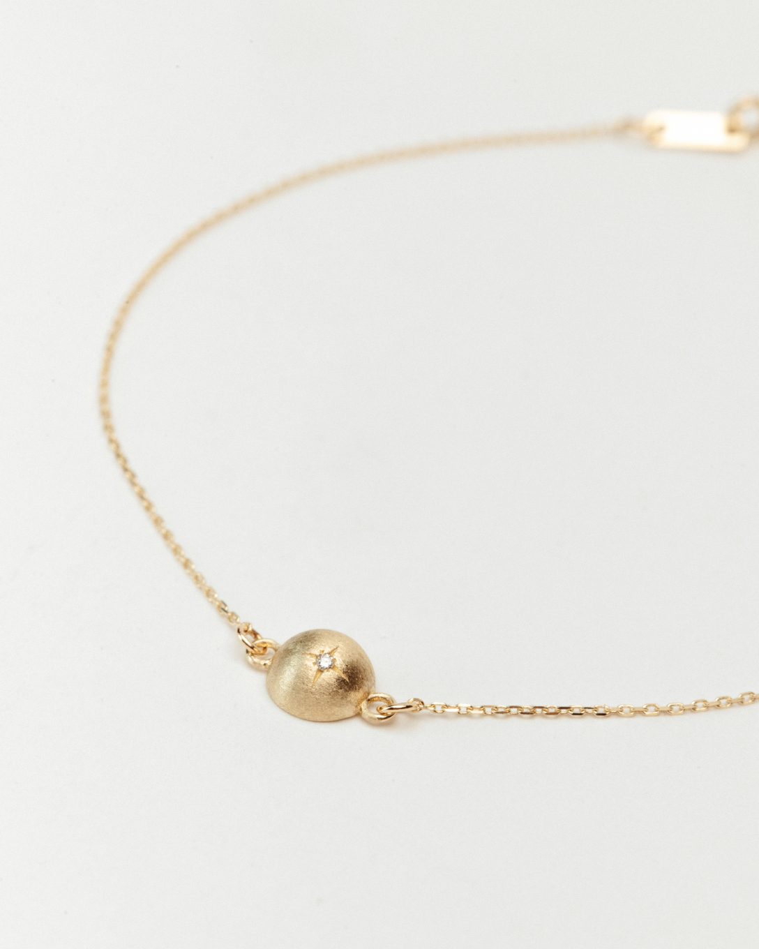 Yellow gold diamond globe bracelet