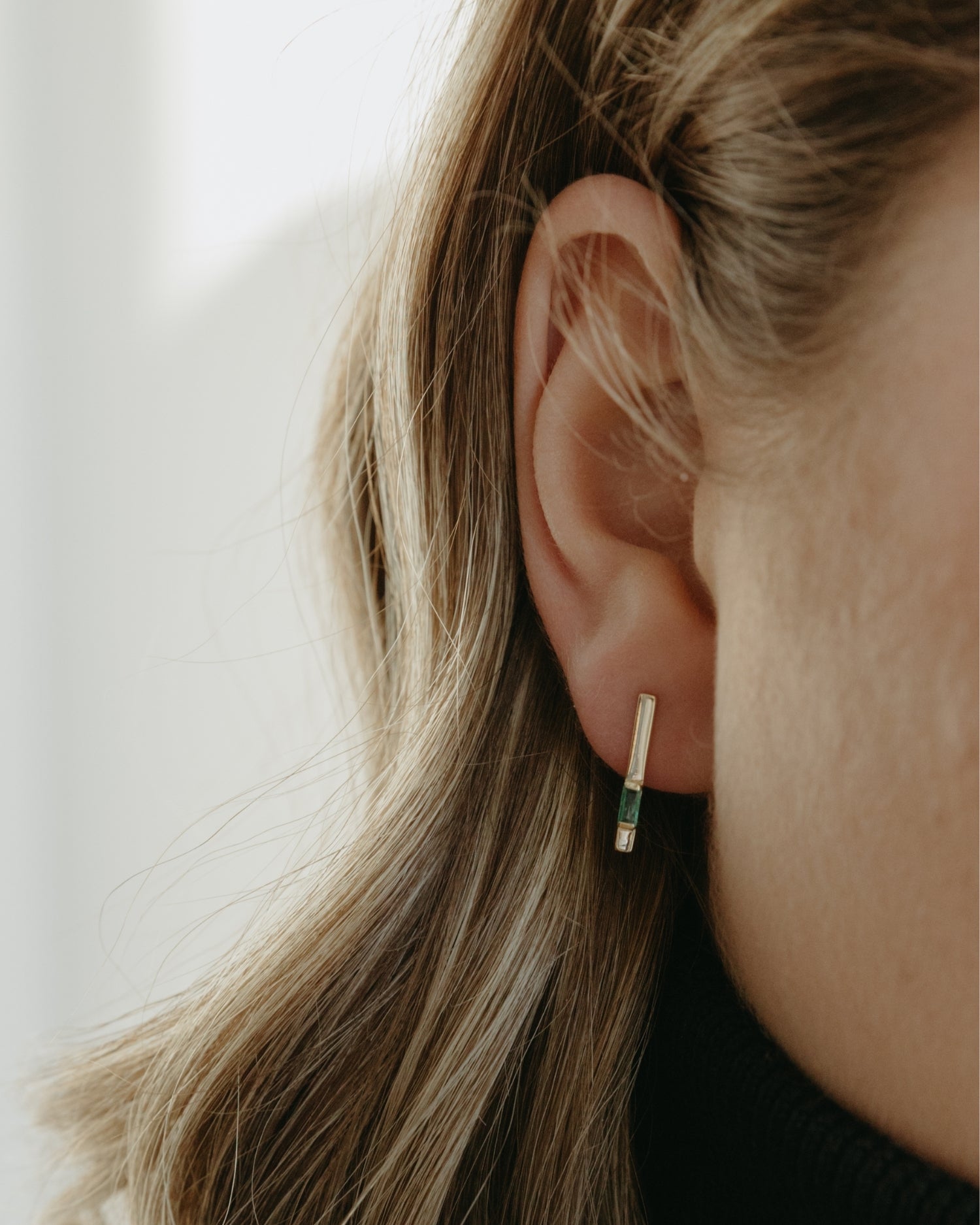 Baguette 14k gold linear earrings with emerald gemstones