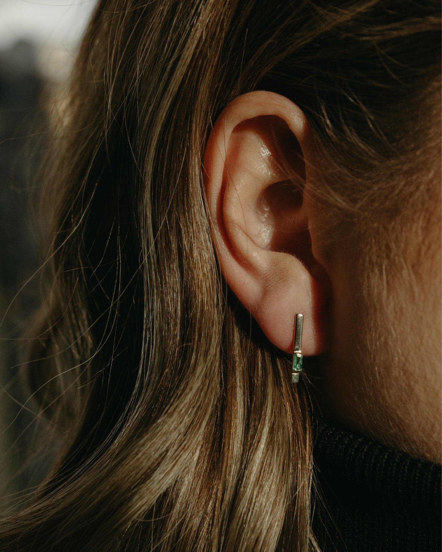 Baguette 14k gold linear earrings with emerald gemstones